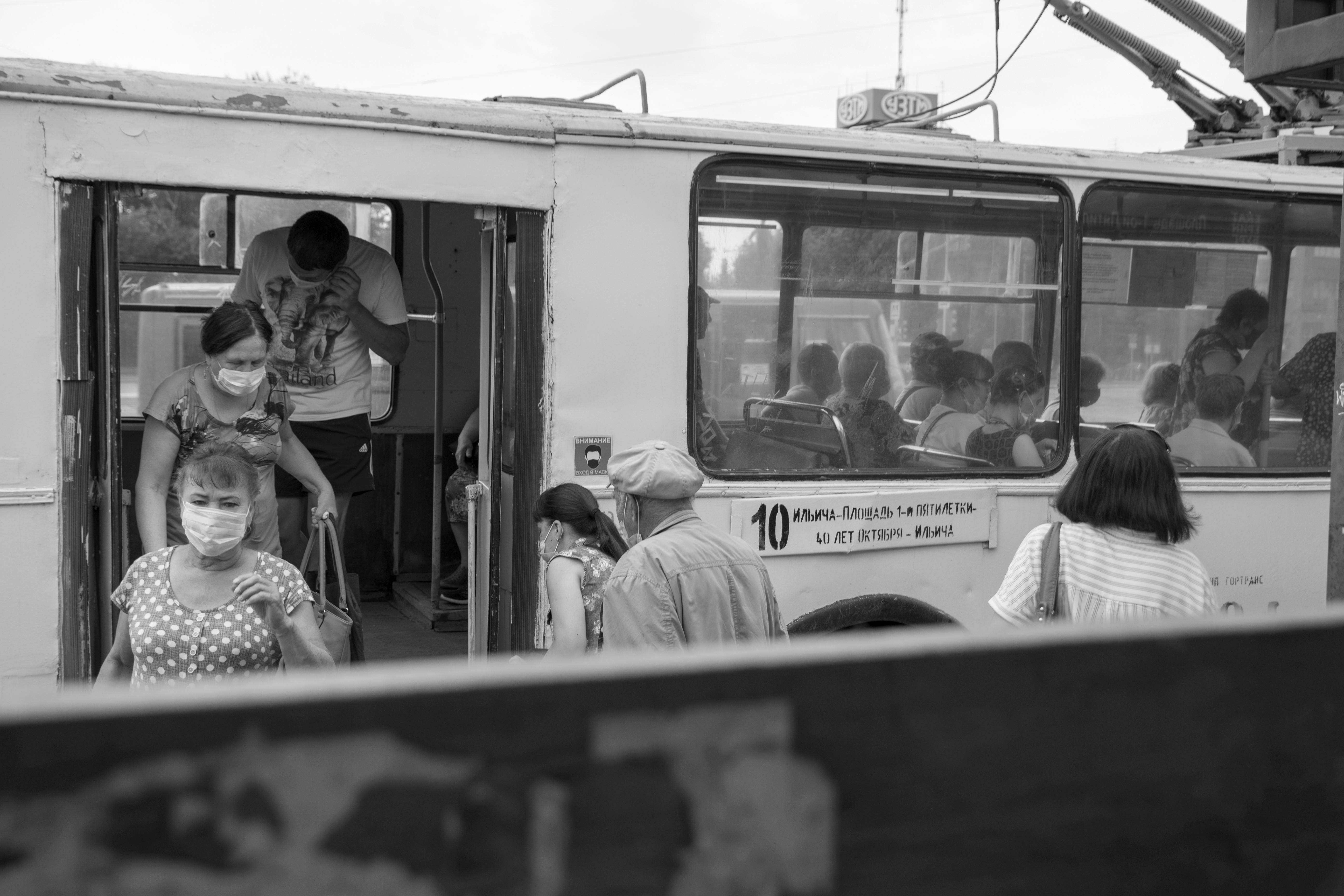 A team of HR professionals in a meeting, reviewing compliance documents with concern.