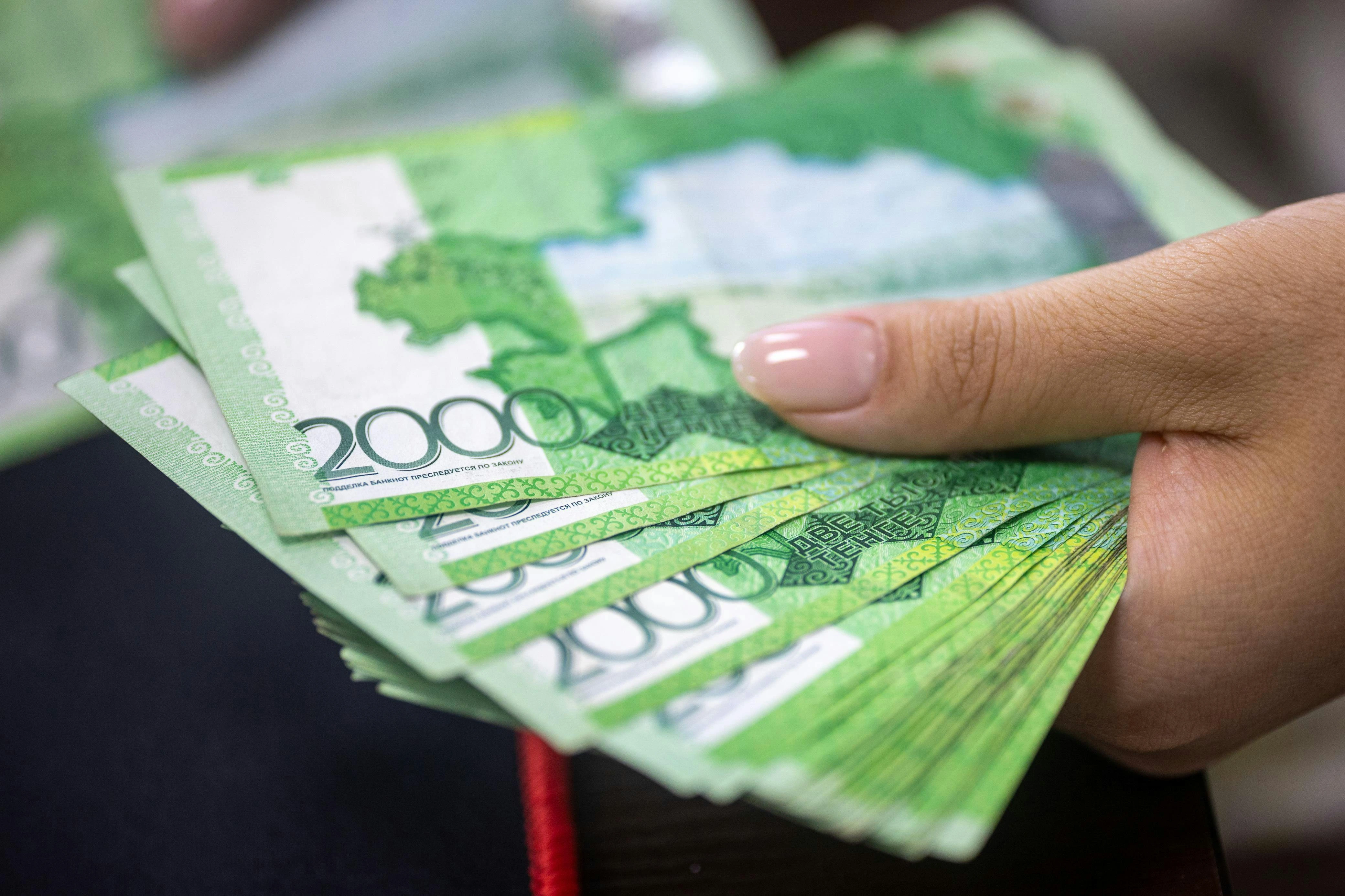 A person writing an application, symbolizing the effort needed to secure a CMA scholarship.